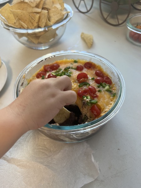 Fresh bean dip enjoyed by little!