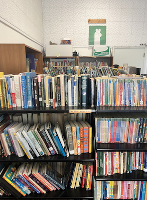 Room full of shelves stuffed with books.